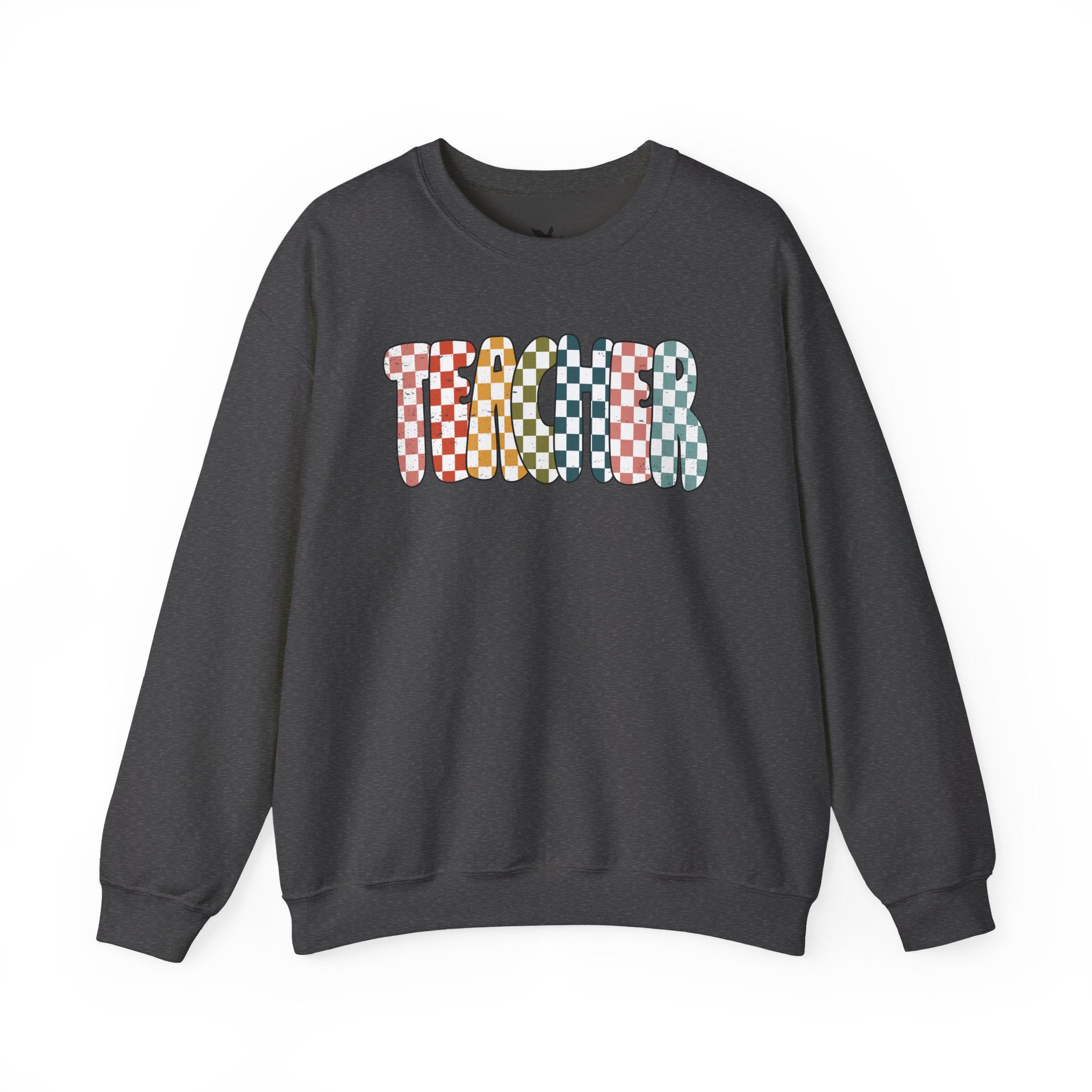 A dark gray crewneck sweatshirt featuring a colorful graphic on the chest that spells 'TEACHER' using different checkered patterns in red, orange, yellow, green, and blue.