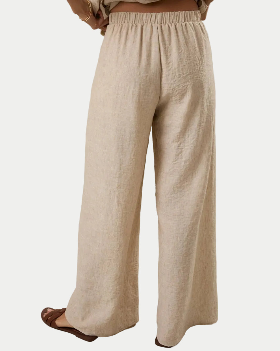 FRONT PLEAT DETAIL BACK WAIST ELASTIC WIDE LEG PANTS - Pockets.  Perfect for date night, summer parties, Graduation guest,  back view -  Blackbird Boutique