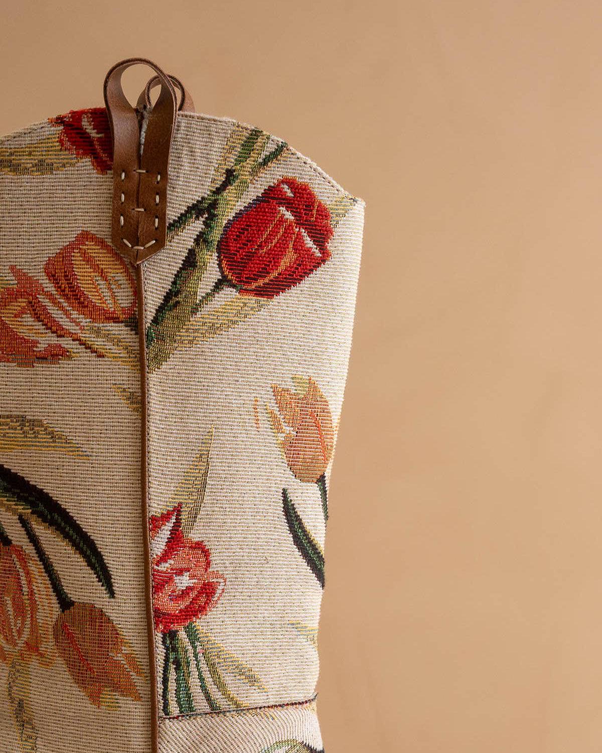 Floral tapestry with red tulips on a beige background