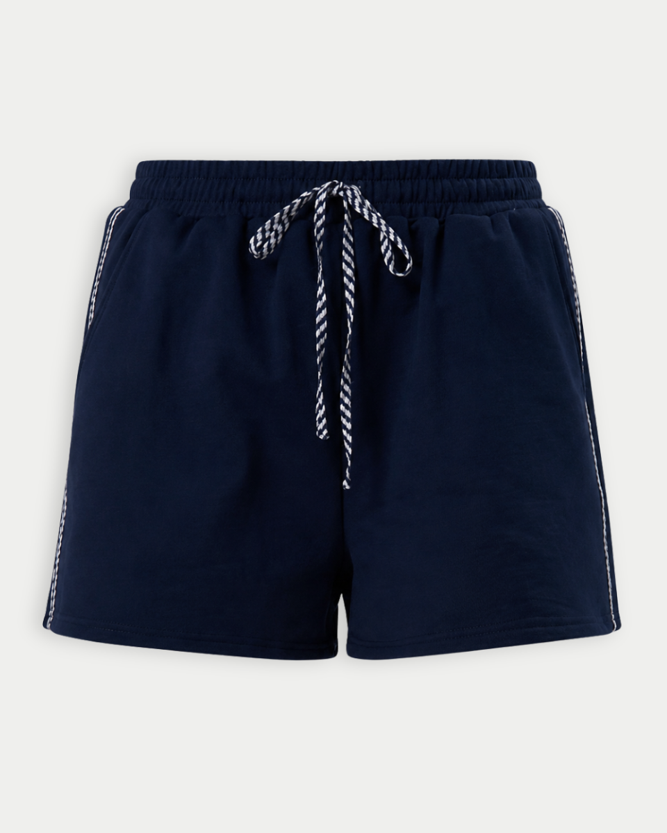 Navy blue shorts with navy and white gingham drawstring on a light gray background