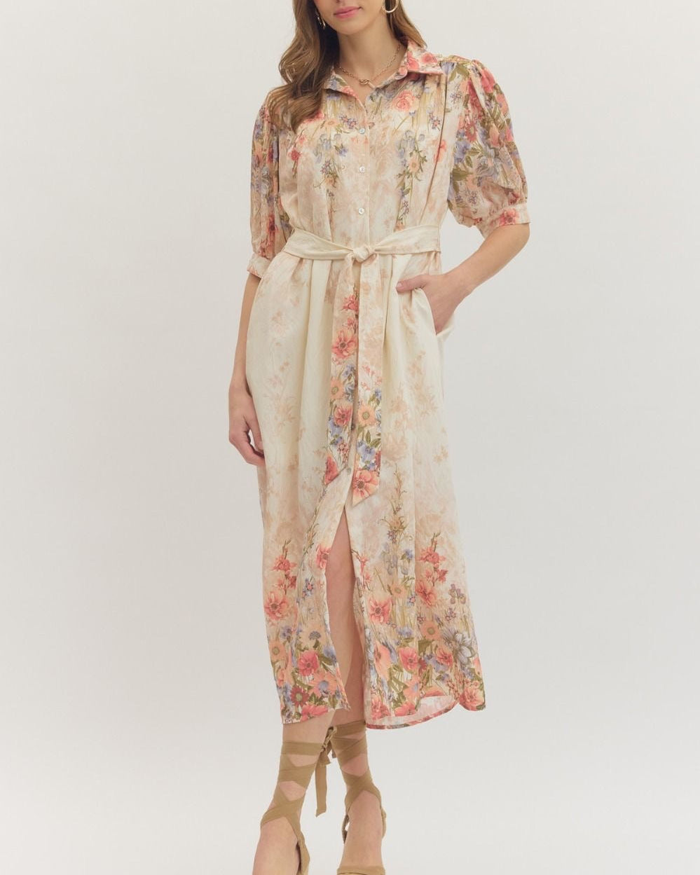 Woman wearing a floral dress with a white background