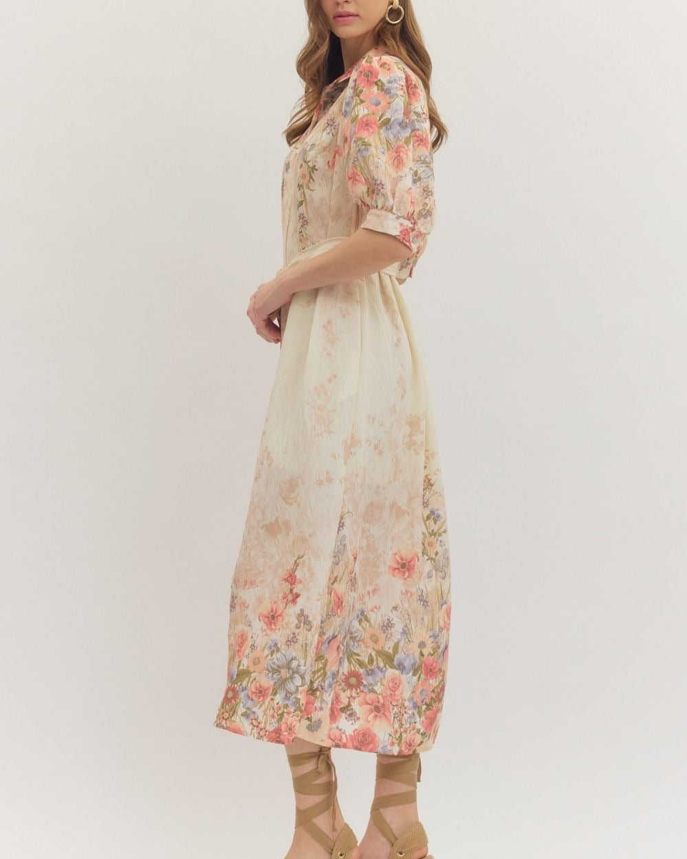 Woman wearing a floral dress on a white background