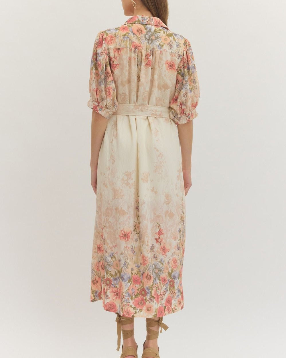 Woman wearing a floral dress on a white background