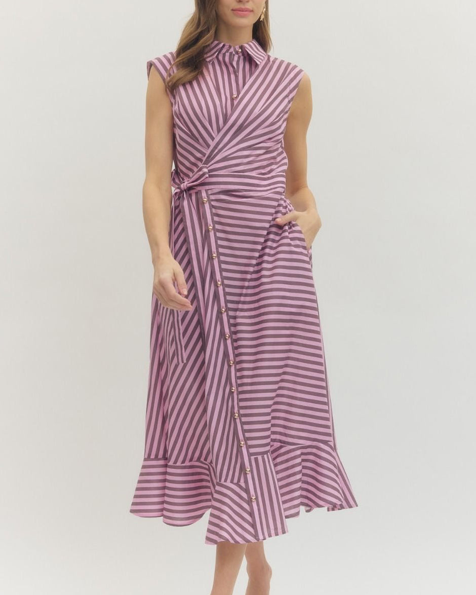 Woman wearing a pink and brown striped dress on a white background