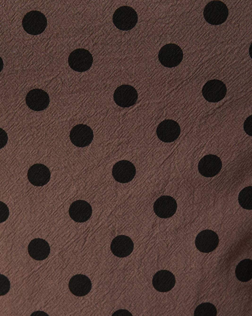Brown fabric with black polka dots