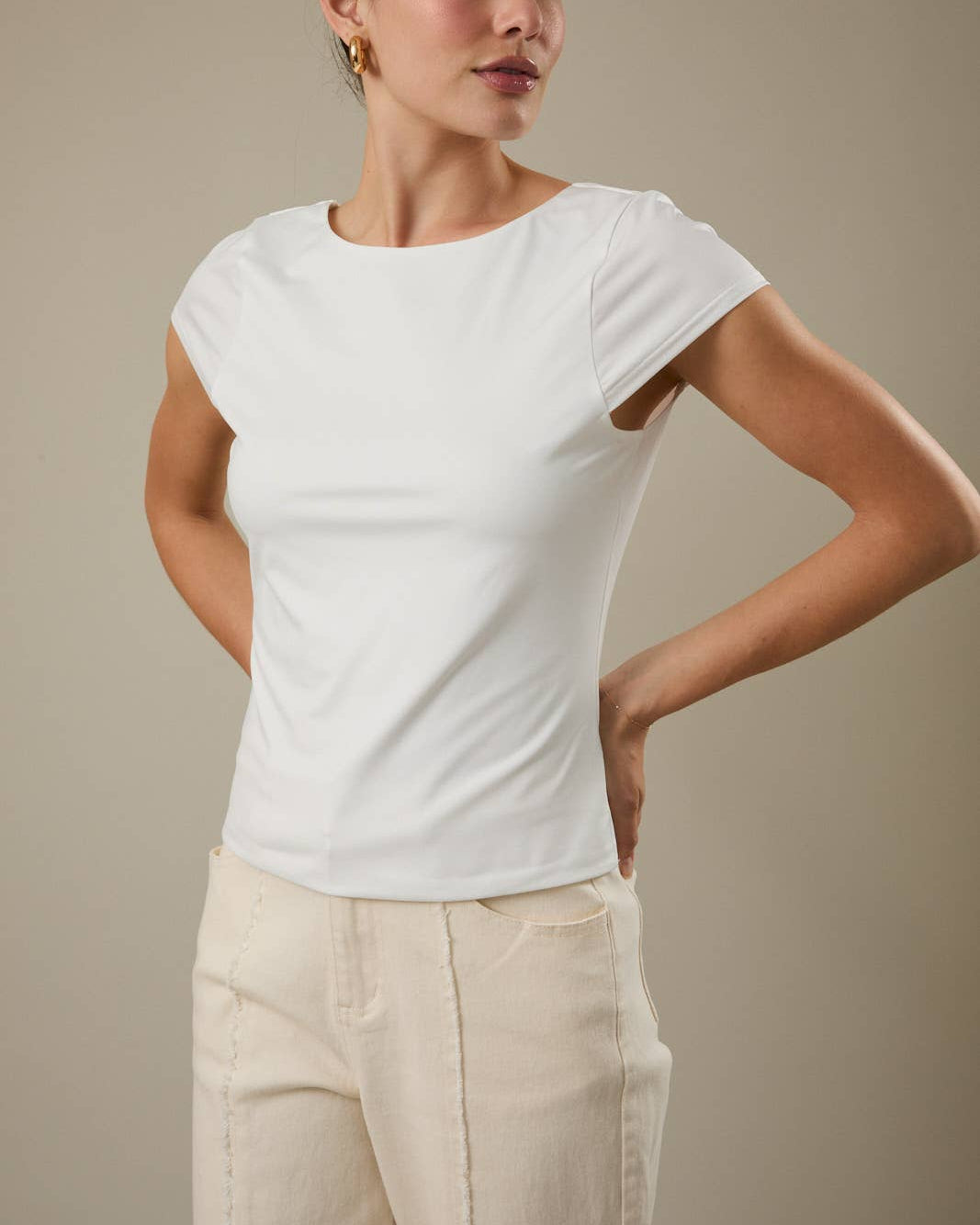 The Double Take Boat Neck Cowl Back Knit Top - on a model with a neutral background.