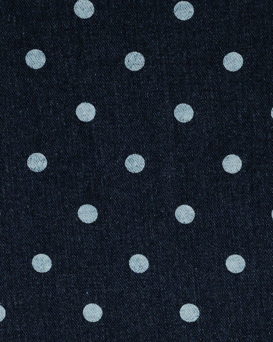 Navy blue fabric with small white polka dots