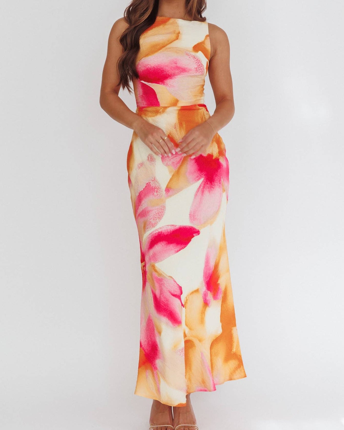 Woman wearing a floral dress on a white background