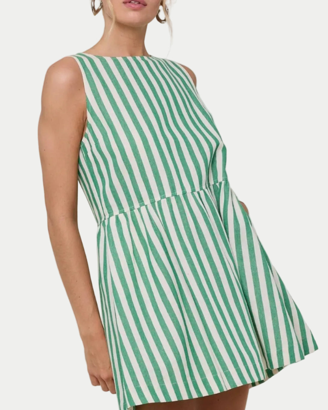 STRIPED MINI DRESS on a model with a white background
